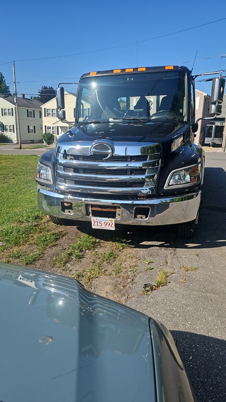 Akanaby Logistics Inc. tow truck parked in Lowell, Massachusetts